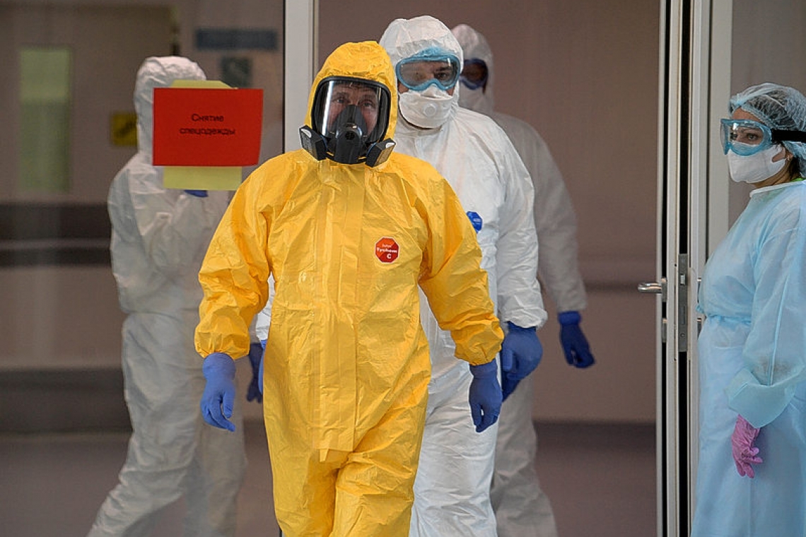 Putin dons hazmat suit as Moscow says coronavirus outbreak is worse than it looks