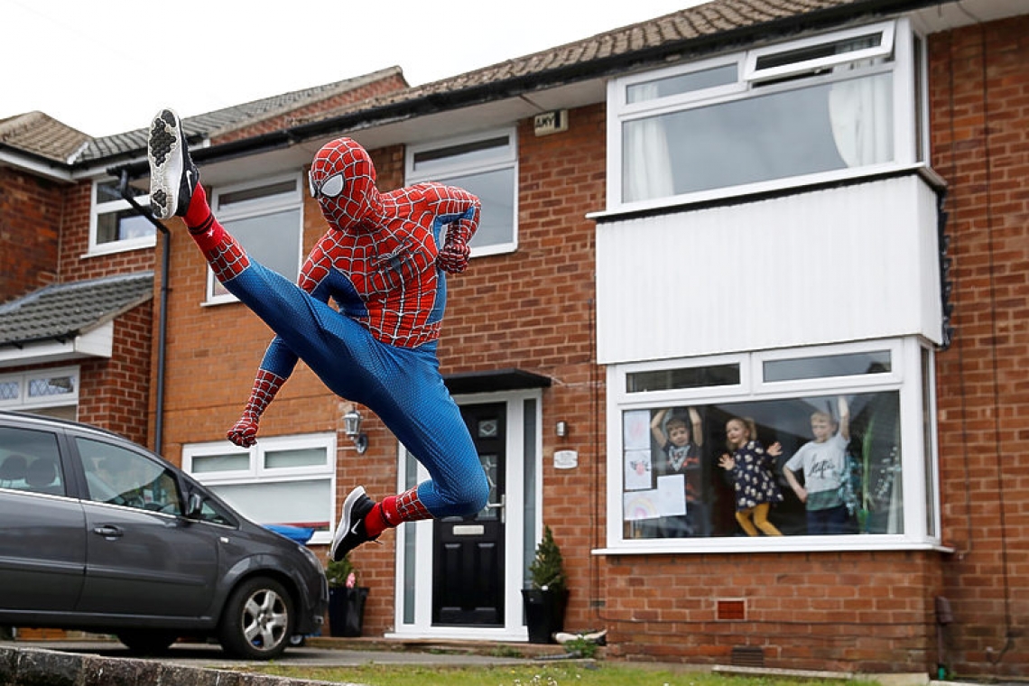 Spider-Man to the rescue! British jogger cheers kids