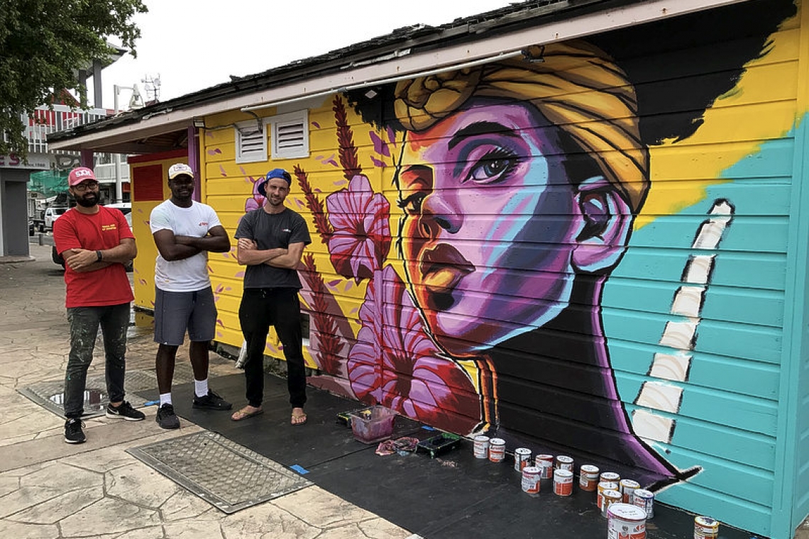       Wall Art bringing colour  and optimism to Marigot