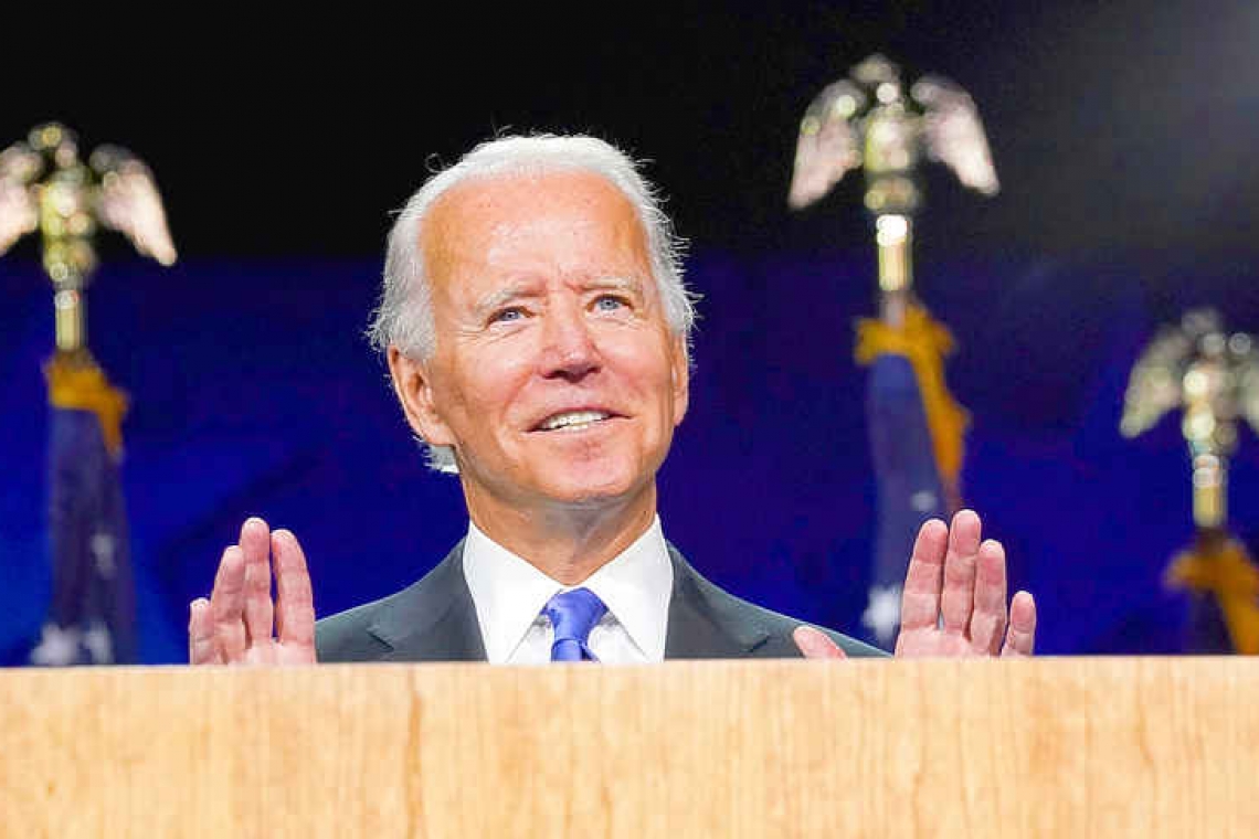 Vowing to turn page on Trump era, Biden promises 'light' over 'darkness'