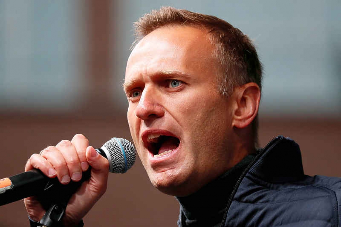 Putin critic Navalny fights for life, aides suspect poisoning