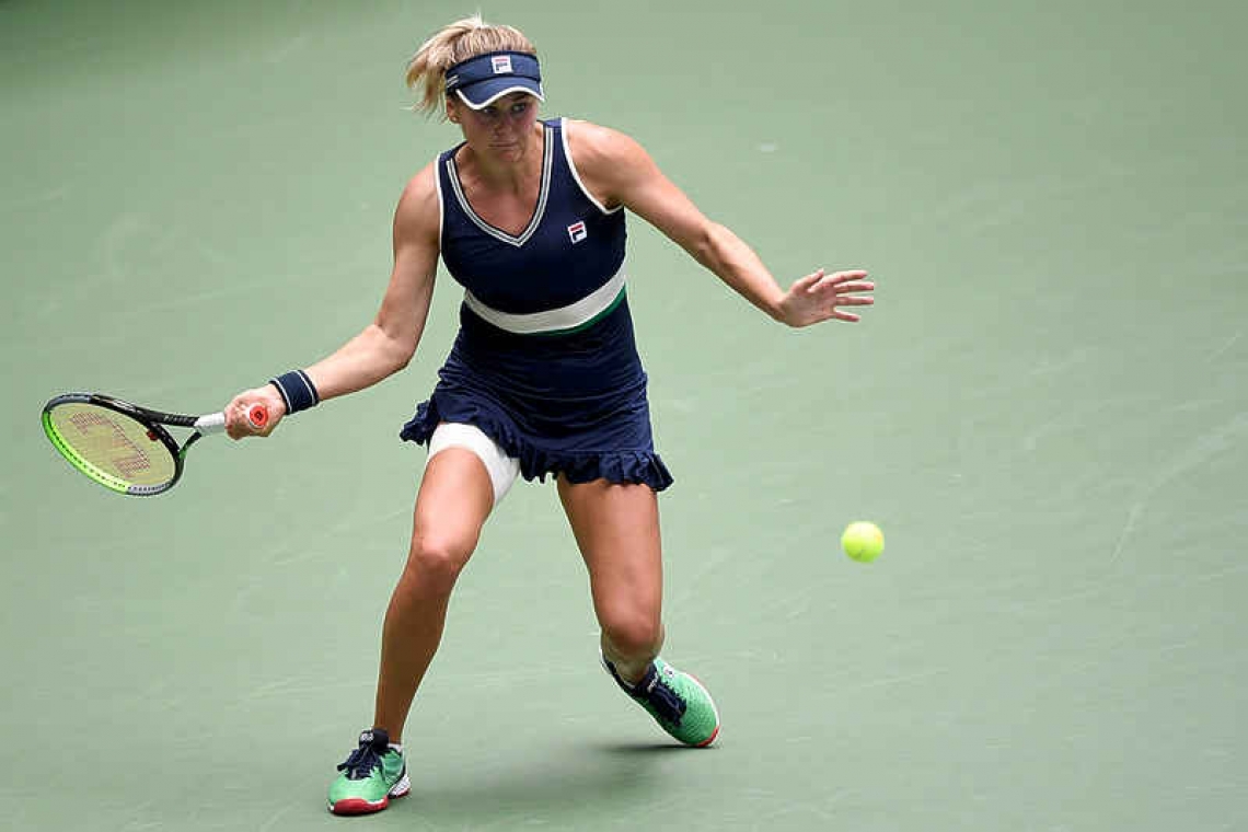 Kvitova tames nerves to  reach  Open third round