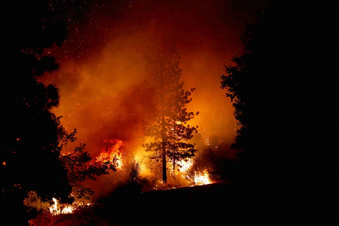 Raging wildfires destroy Washington  town, roar through California, Oregon