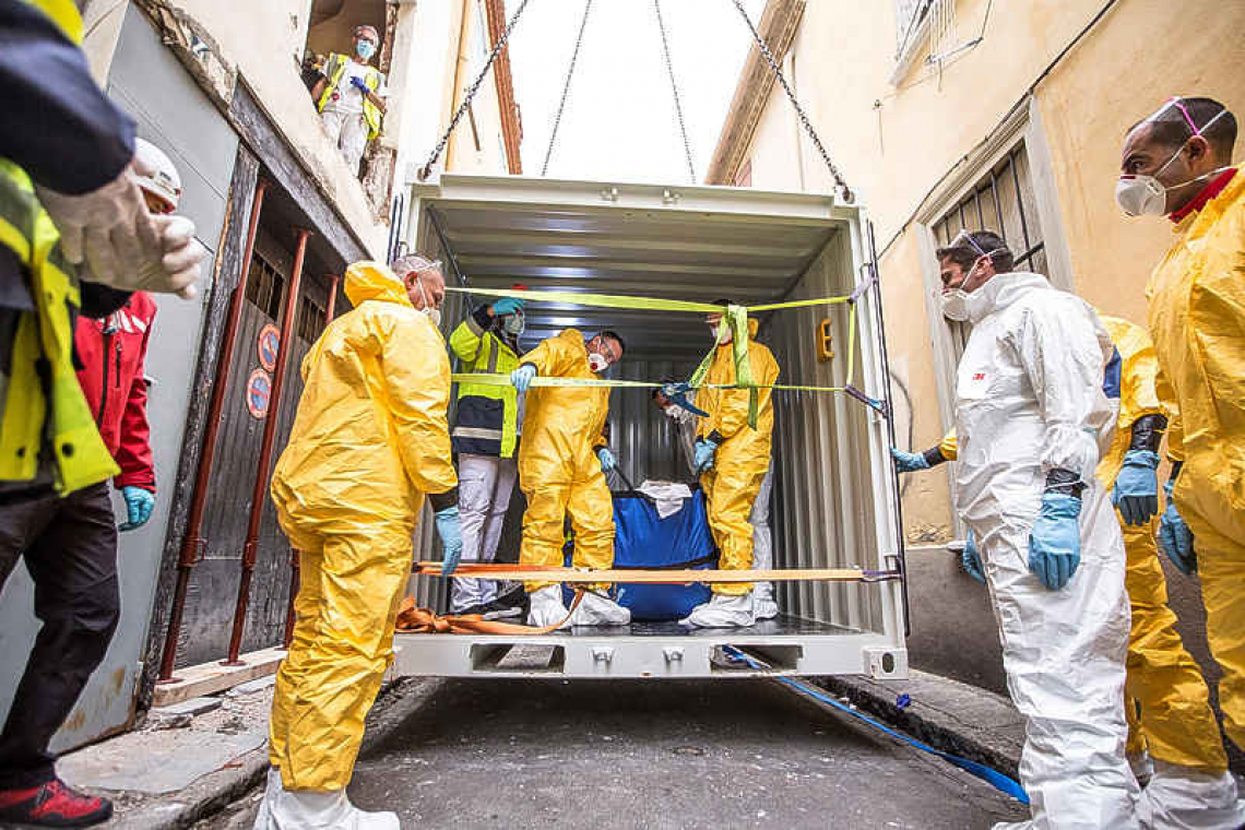 French rescuers rig crate to help obese man stuck in home