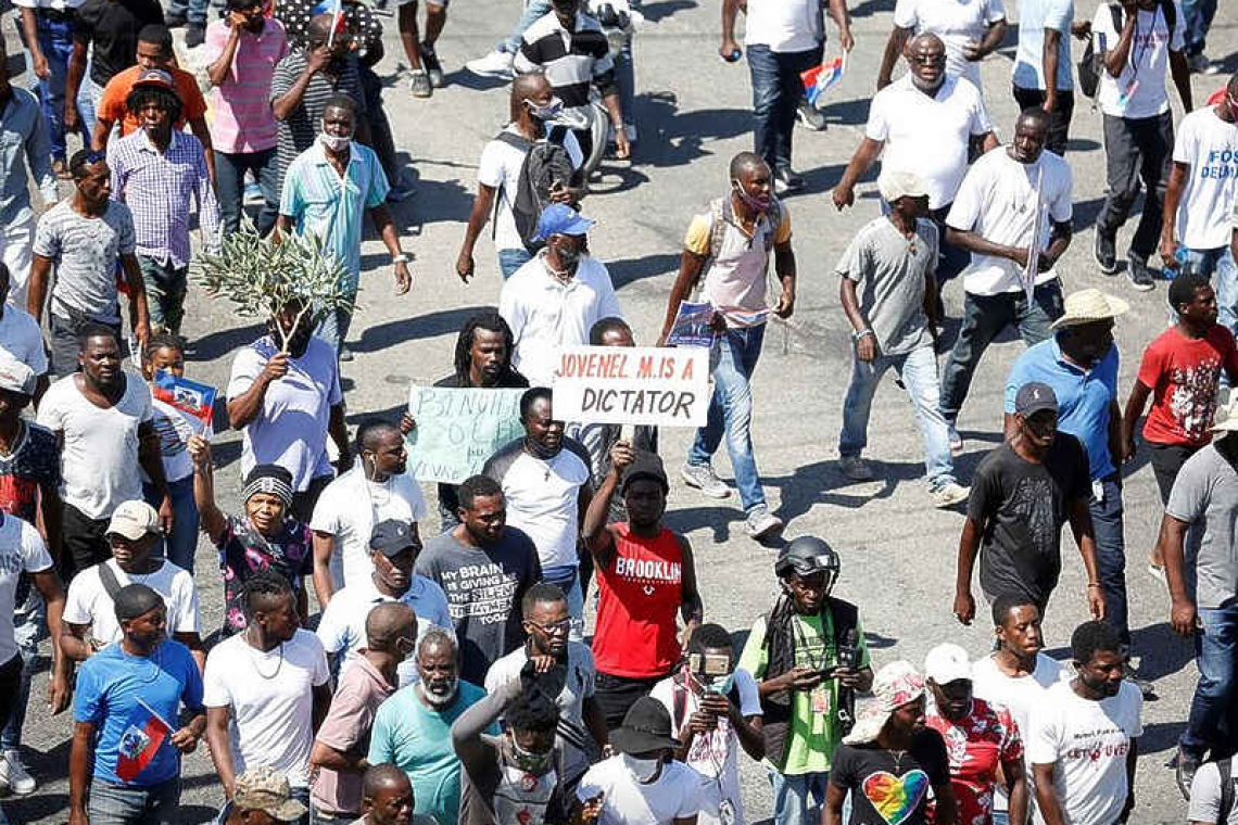    Haitians barricade streets to protest  insecurity after gang murders of police