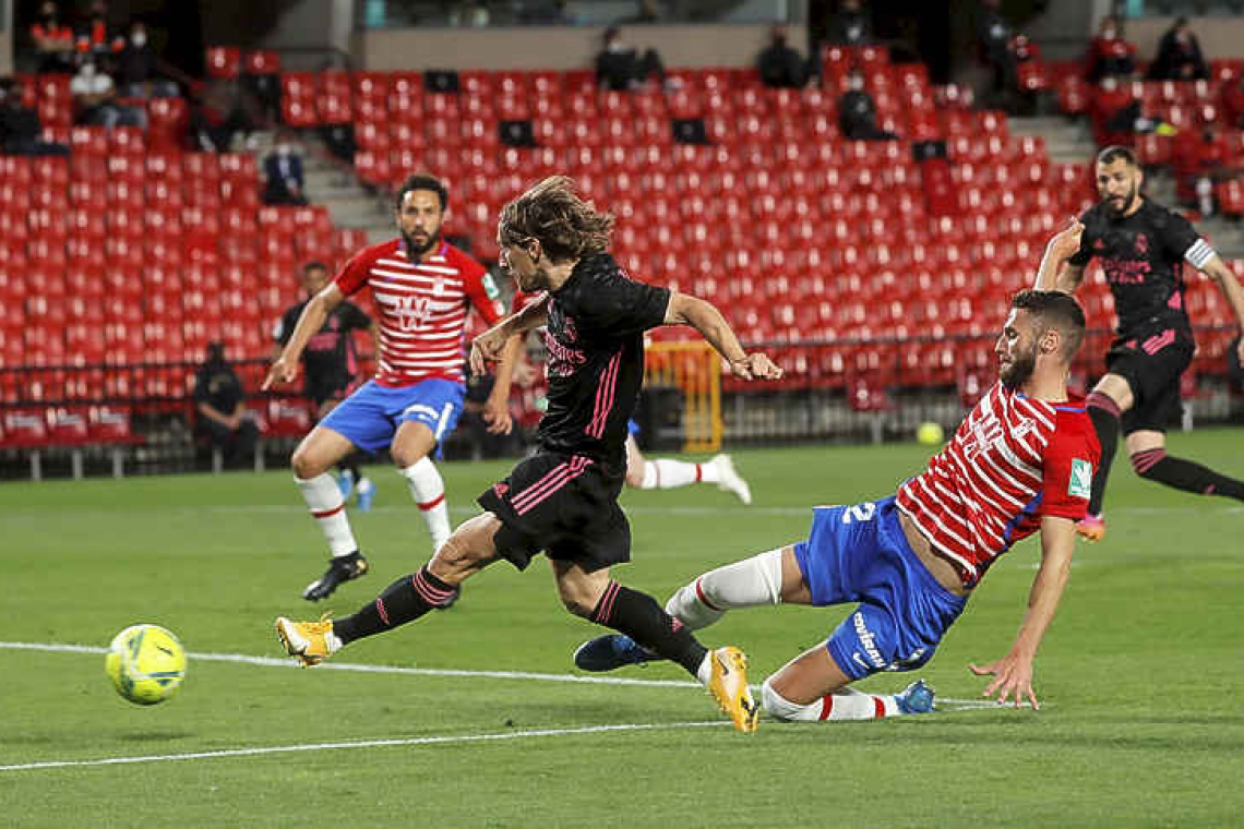 Real sink Granada 4-1 to keep pressure on Atletico