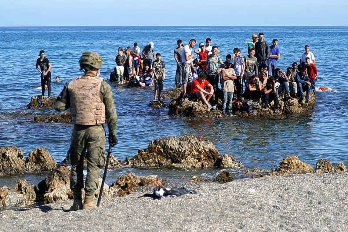 Spain vows to restore order after thousands swim into Ceuta enclave