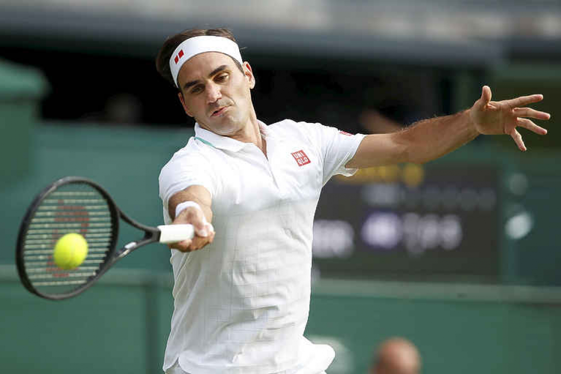 Federer gets his sparkle back as sun shines at Wimbledon