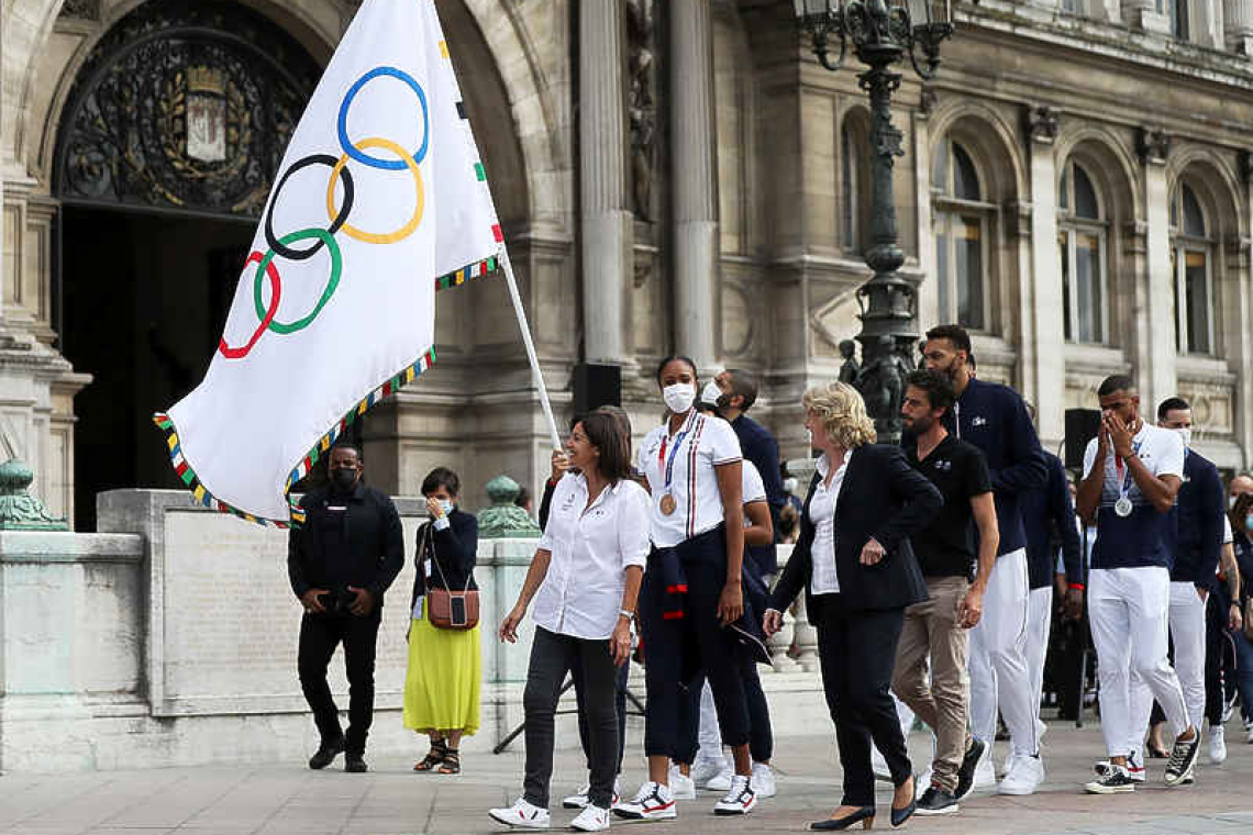 Flying the Olympic flag, Paris looks beyond COVID for 2024 games