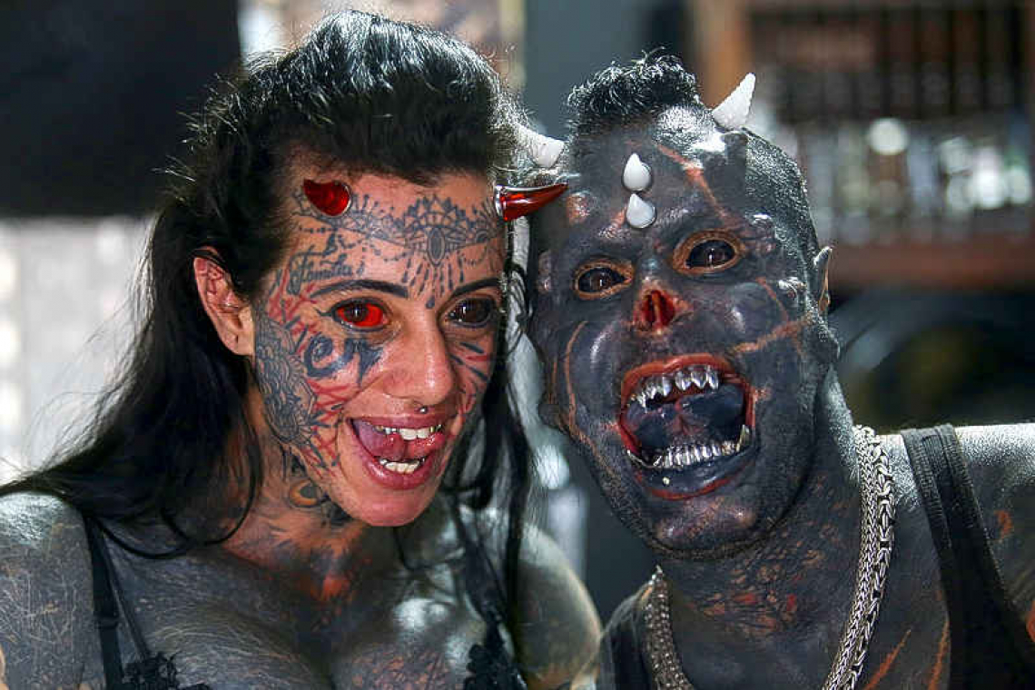 Brazilian tattoo artist Prado morphs into devil look-alike