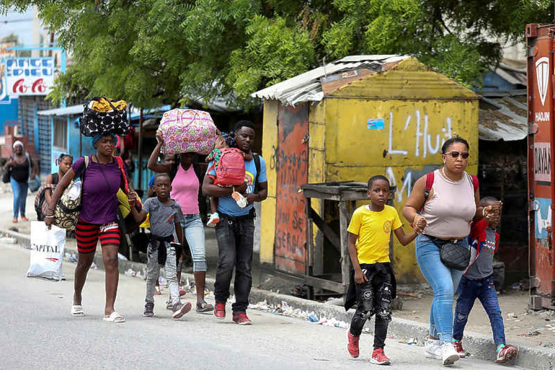 Haitian families flee homes as  violence flares in Port-au-Prince