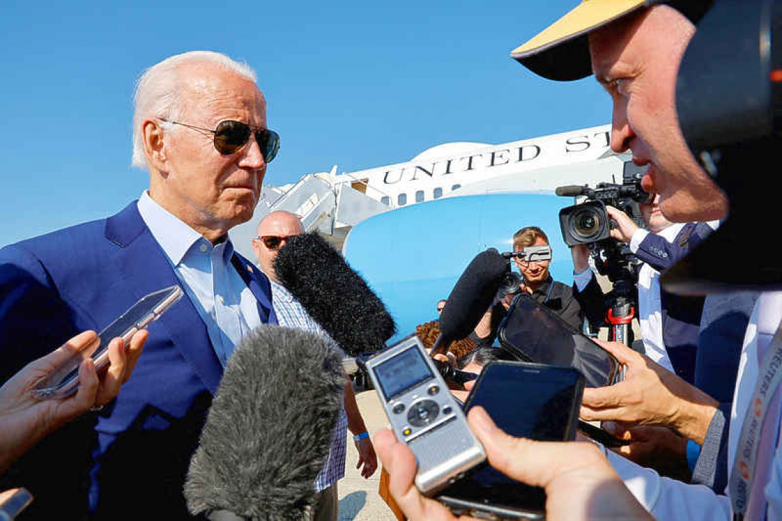 Biden stops short of declaring climate emergency, takes steps on wind power