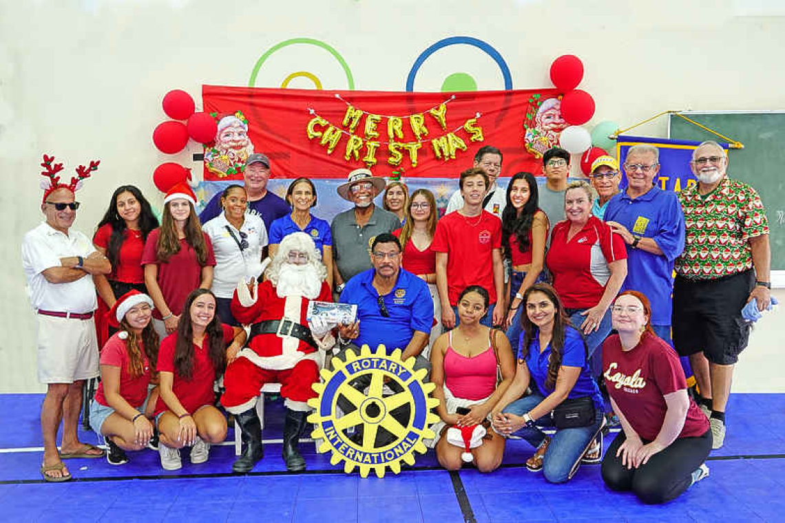    All smiles during annual  Children’s Holiday Party