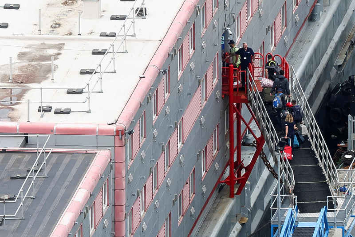 UK moves some asylum seekers to a barge on southern coast 