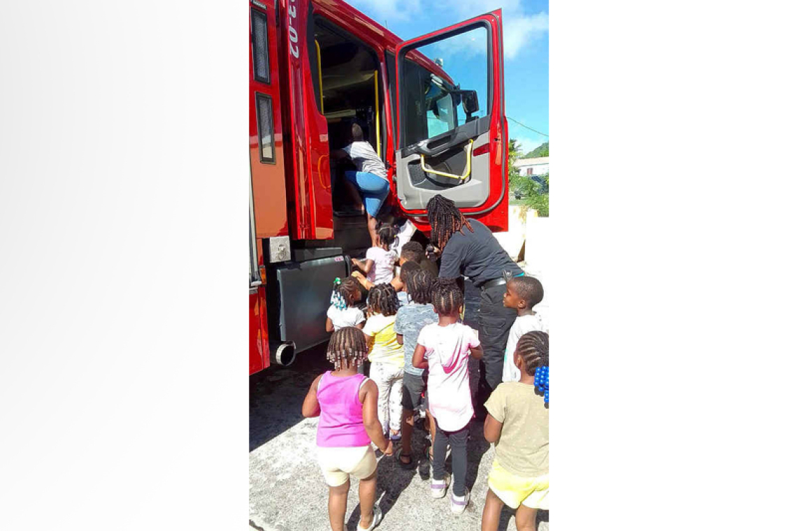 Firefighters spend time with  children at daycare centre