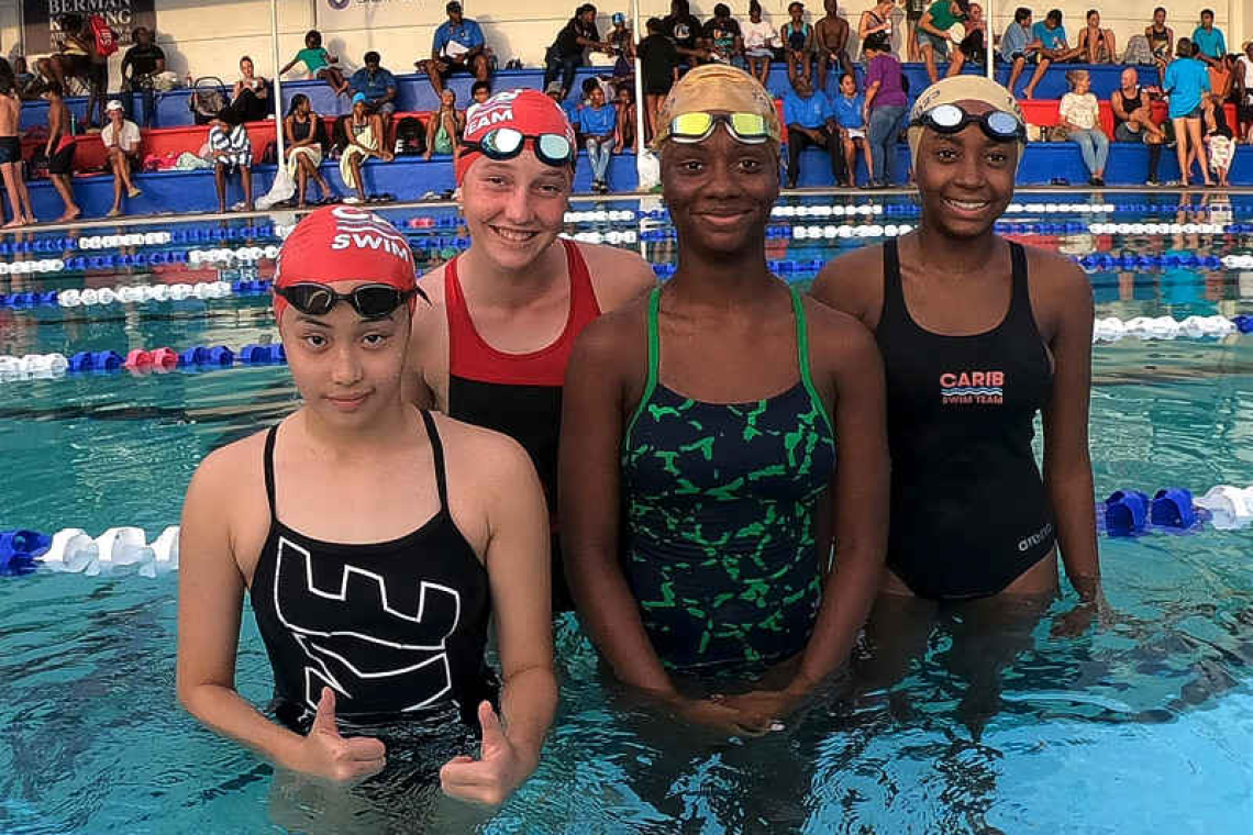 Carib Swim Team shines in competitions, hosts guardian group swim meet