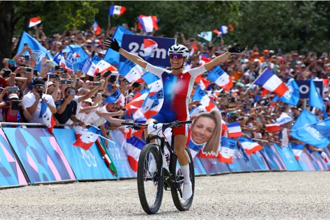  All smiles now for golden medal Frenchwoman Ferrand-Prevot 