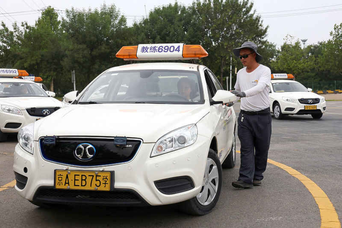 China's drivers fret as robotaxis pick up pace