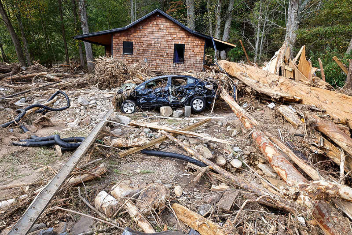 Biden and Harris view hurricane devastation, 1,000 troops deployed