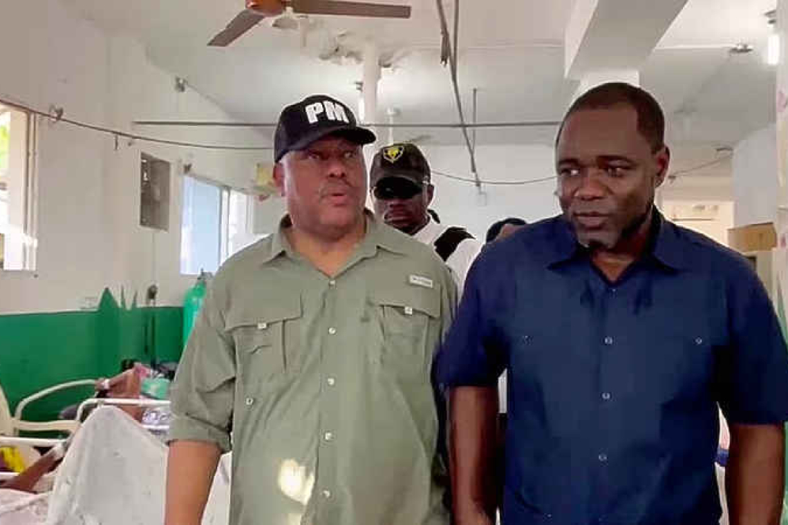 Haitian prime minister goes abroad  for support after gang massacre