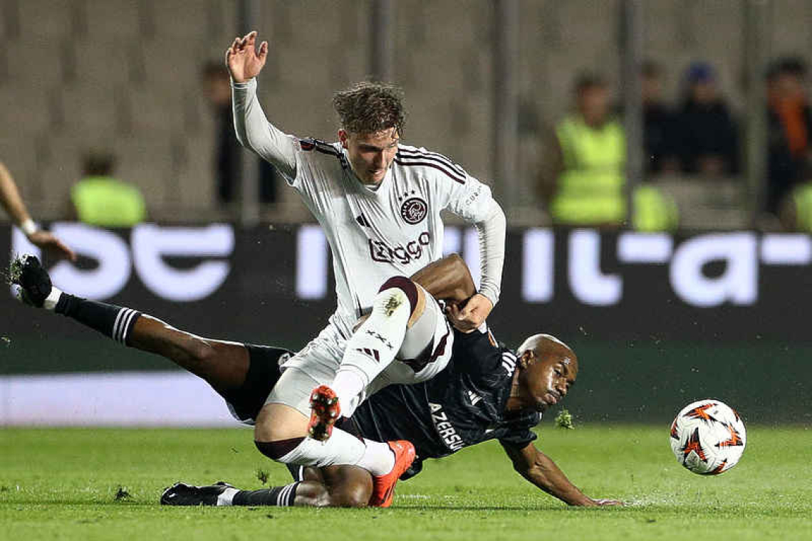 Ajax eases to victory over 9-man Qarabag 