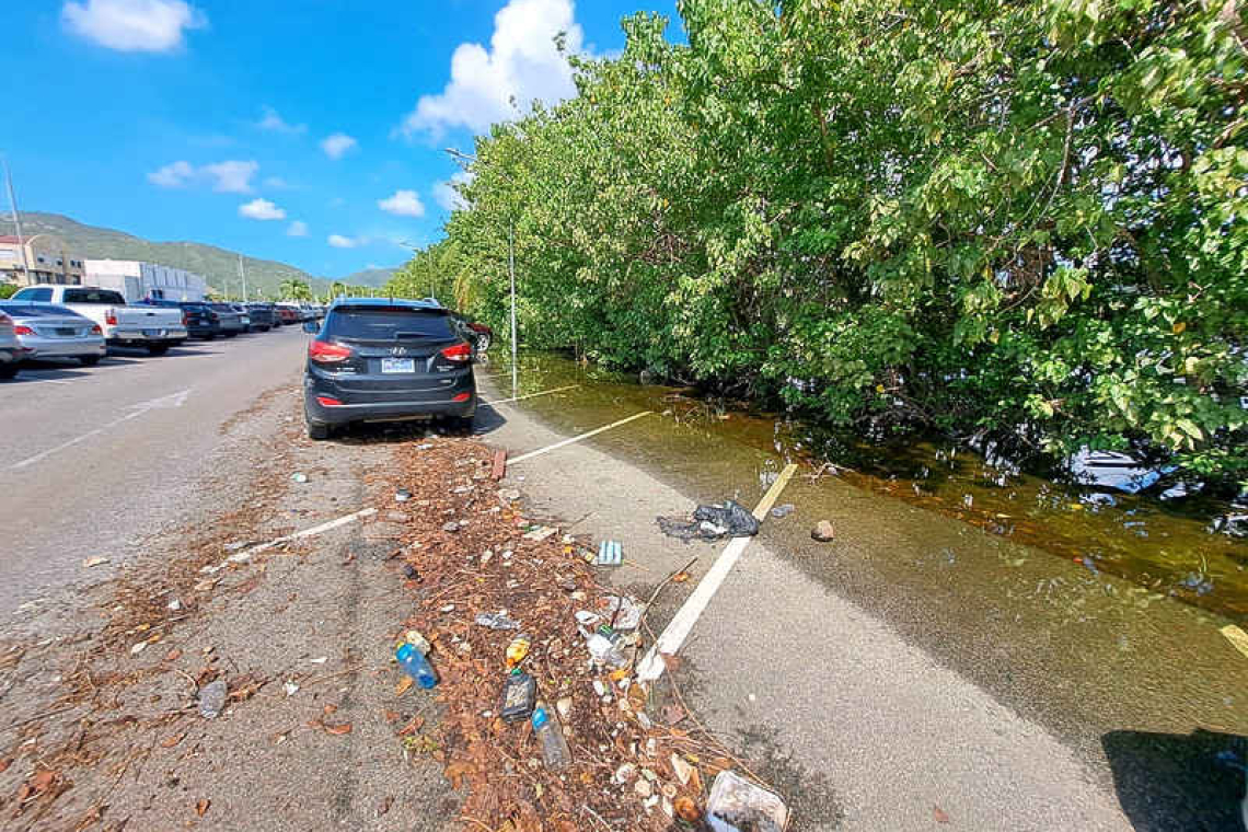    Great Salt Pond overflowing onto  W.J.A. Nisbeth Road parking lot