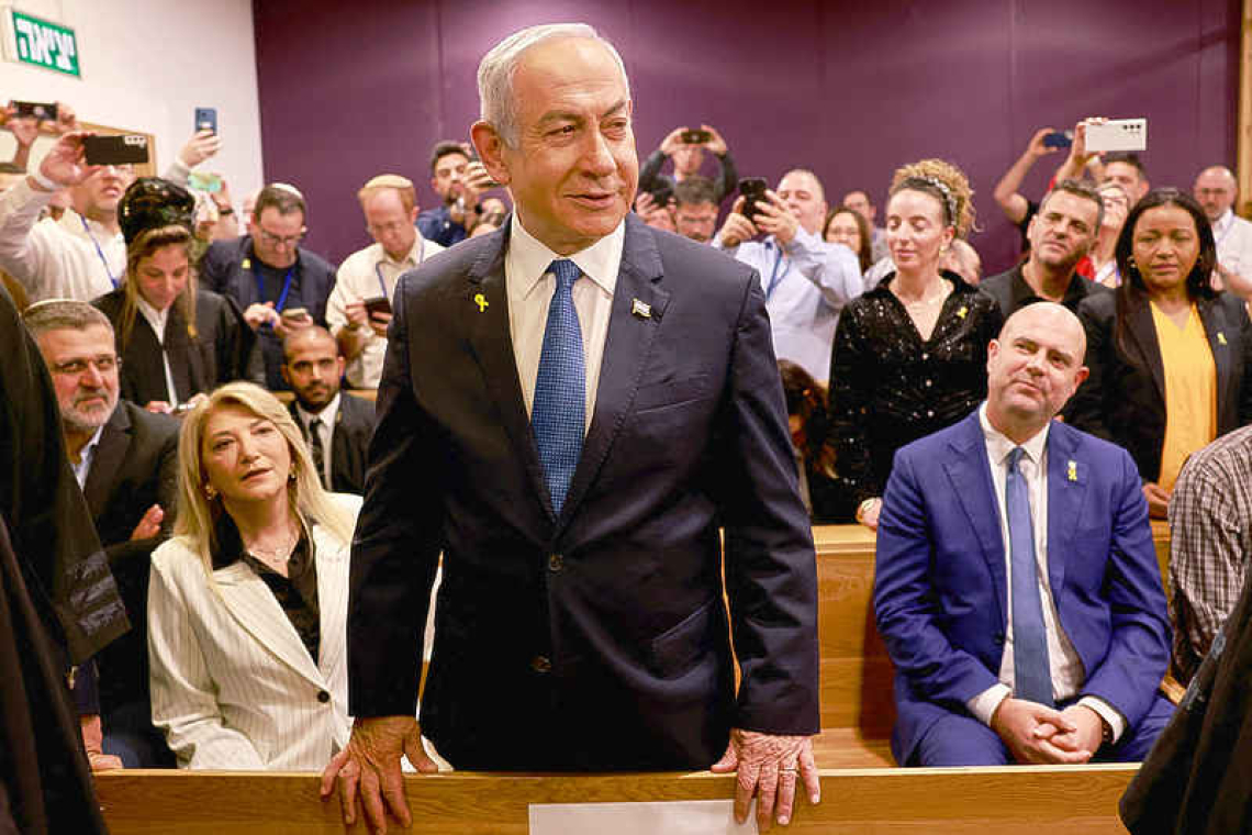 Netanyahu assails media as he testifies for first time in his corruption trial 