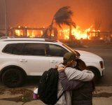 Los Angeles surrounded by out-of-control wildfires; at least 5 dead