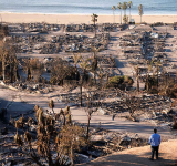 LA races to contain wildfires  before severe weather returns