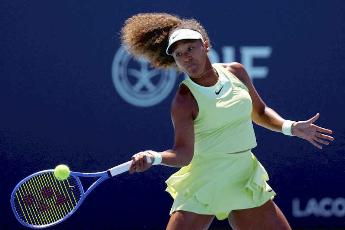 Osaka battles back to advance in Miami